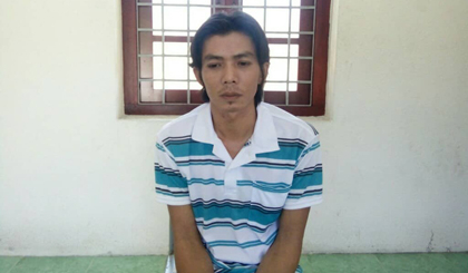 Nghi phạm Lê Văn Minh tại cơ quan công an.