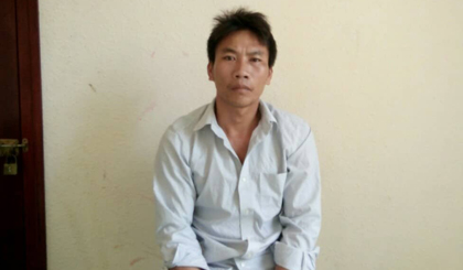 Nghi phạm Đinh Văn Nhịn tại cơ quan công an.