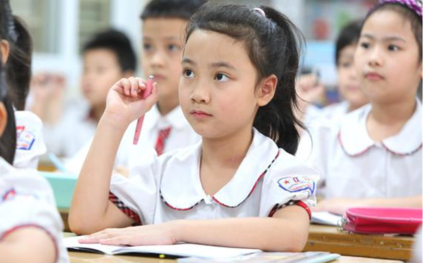 Đã có lộ trình miễn, giảm học phí ở các cấp học, nhưng tùy điều kiện của từng địa phương. Ảnh: Thành Đạt/TTXVN